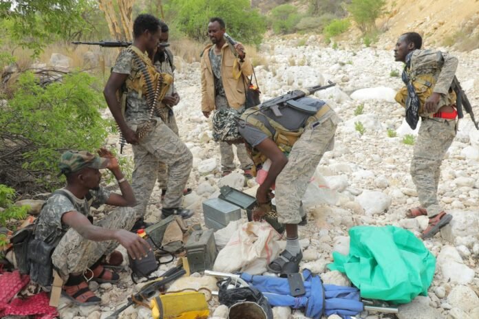 Puntland security forces inspect roadside blast site near Bosaso